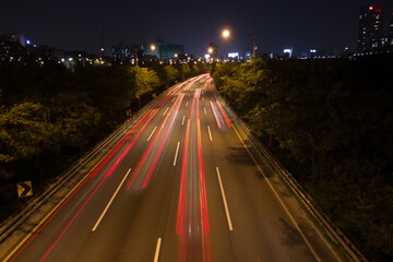 Fototapeta na wymiar Light trajectory created by a car running at night