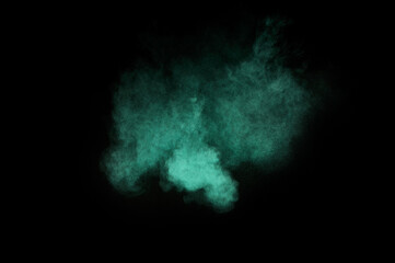 Aquamarine powder explosion on black background. Colored powder cloud. Colorful dust explode. Paint  Holi.