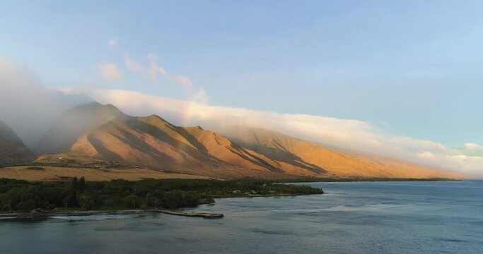 West Maui mountains rainbow and ocean.