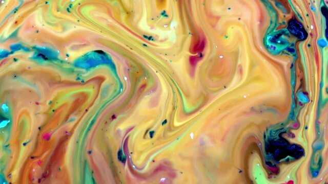 Liquid Colorful Paint Mix in slow motion. Liquid color paint patterns texture.
