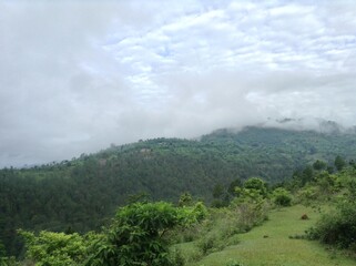 Attractive green hill with beautiful cloudy sky at morning time