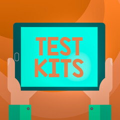 Text sign showing Test Kits. Business photo showcasing tools used to detect the presence of something in the body Hu analysis Hand Holding Blank Screen Tablet Smartphone Display Unit photo