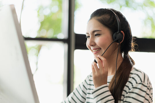 Young Business Asian Woman Working Call Centre Customer Service Agents. Business Female Support Operator With Computer And Headset In Office.