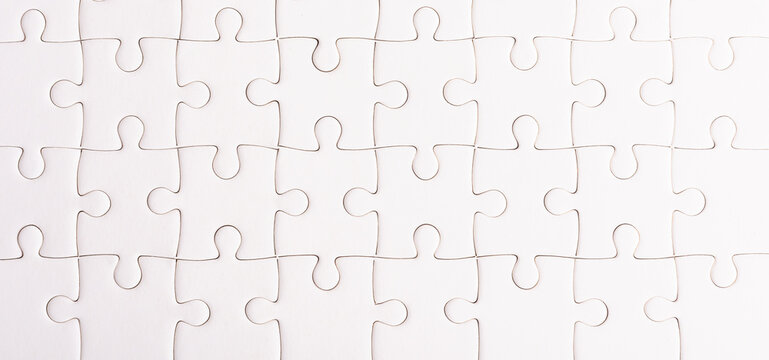 Top view flat lay of paper plain full white jigsaw puzzle game texture background, quiz calculation concept