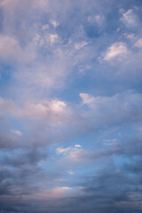 Naklejka na ściany i meble Amazing dramatic cloudy sky in white, blue and purple tones with sunlight