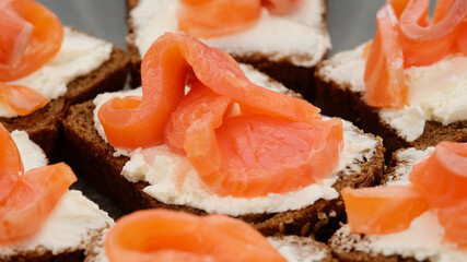Appetizing Salmon and soft Cheese on Fresh Bread. toast with salmon