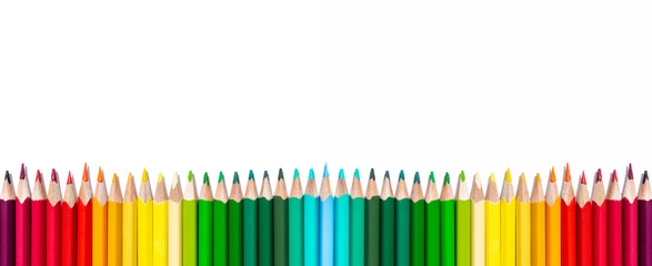 A row of multi-colored pencils isolated on a white background