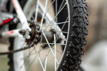 Fototapeta premium Wheel with a tread with a chain closeup. Bike, cardio workout.