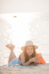 woman enjoy use smartphone  on the beach