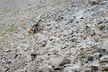 Truck crash or accident falling over the cliff of a dangerous road on mountain in Kashmir, India.