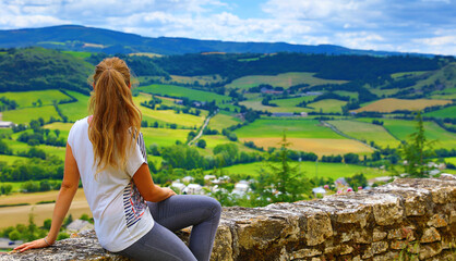 Fototapeta na wymiar woman traveling in France- beautiful rural landscape in Aveyron