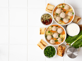 potato soup with meatballs, carrots and herbs