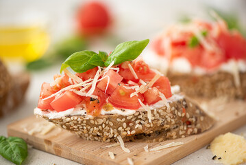 veggie sandwich with pink tomatoes, parmesan and basil