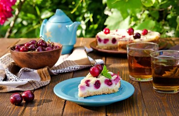 Sliced shortcake with cottage cheese and cherry on a blue plate.