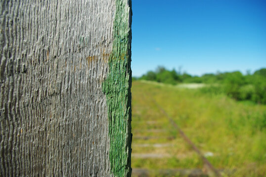 .Abandoned and overgrown with grass. wooden stob for stopping trains.
