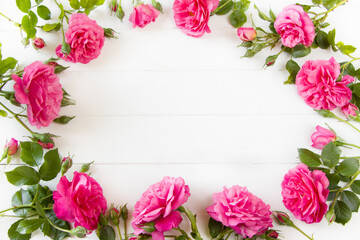 Pink Roses flat lay, floral composition on white wooden board, empty space for  text, concept for Wedding , St. Valentine's Day, Mother's Day, Birthday, 8 march, women's day, mock up design