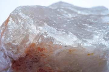 The texture of natural quartz with chips and interspersed in different shades of red with a strong increase and soft focus.