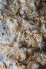Blurred when heavily magnified, with a fine granite texture. Soft colors and fine details of the texture are not visible to the naked eye.