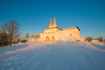 Ferapontov monastery in the light of the setting sun on a December evening. Vologda Oblast, Russia