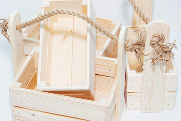 An empty wooden box. Made of pine and plywood, on a light white background.
