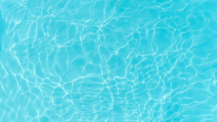 Blue water in the pool. Beautiful stains, abstract water background.