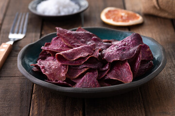 slice purple sweet potato fire on wood