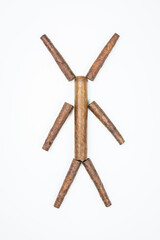 Man made from cigars on white background.