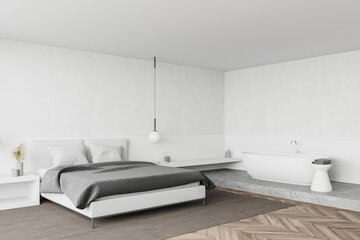 White bedroom corner with bathtub