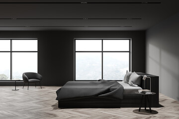 Grey master bedroom with armchair, side view