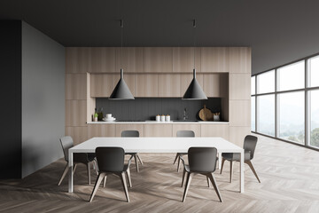 Grey and wooden kitchen interior with table