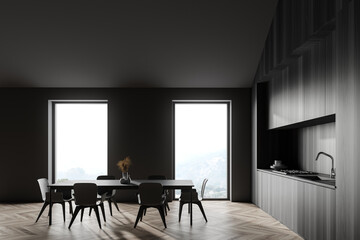 Fototapeta premium Grey and wood attic kitchen with table, side view