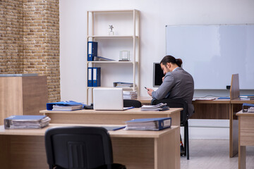 Young male businessman employee working in the office