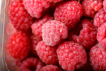 Fresh raspberries in store packaging.