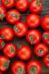 Fresh tomatoes on a wooden table. Harvesting tomatoes.