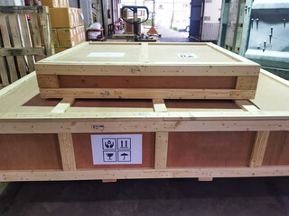 Shipment cartons box on pallets and wooden case on hand lift in interior warehouse cargo for export and sorting goods in freight logistics and transportation industrial