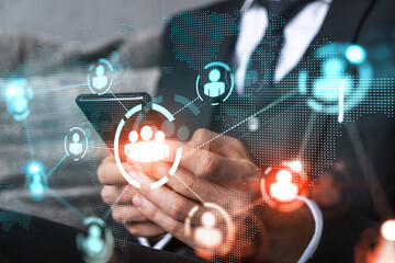 Businessman using on-line app on phone. social network icons hologram. Multiexposure. People connection concept.