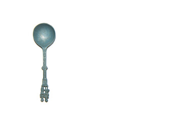 Antique German tin spoon on a white background. The view from the top. The image has space for text.