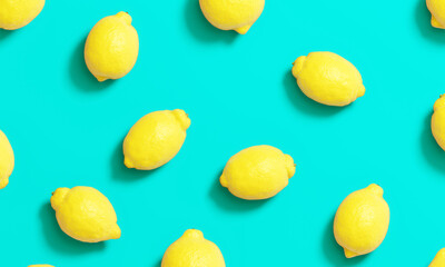 Pattern summer lemons on blue background