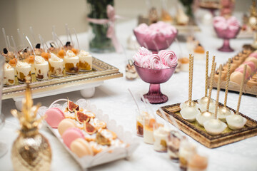 beautifully decorated table with sweet candy bar