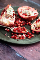 Beautiful food portrait of Pomegranate and seeds with old vintage texture background