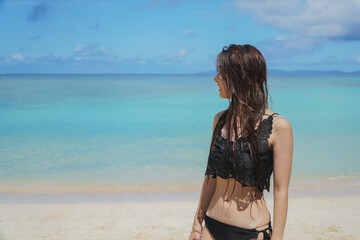 石垣島の海と水着を着た女性