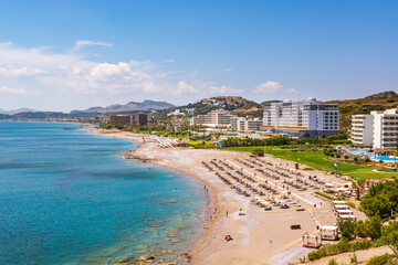 Beautiful sandy beach in Faliraki. Rhodes island, Dodecanese, Greece. © vivoo