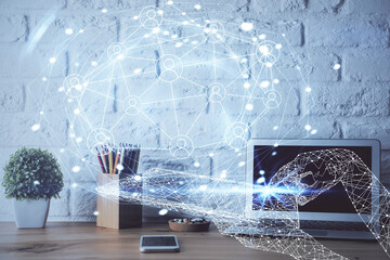 Computer on desktop with social network hologram. Double exposure. Concept of international people connections.