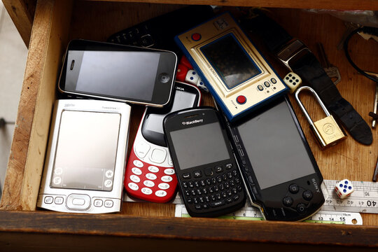 Old and vintage electronics gadgets or devices inside a drawer