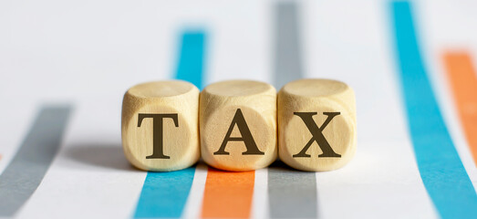 TAX text on chart background. business concept
