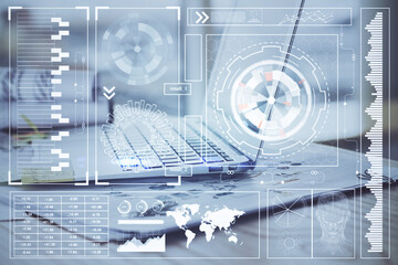 Double exposure of laptop computer and technology theme hologram. Concept of freelance work.