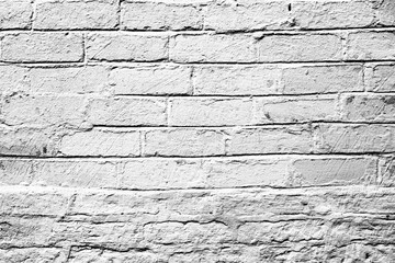 Texture of a brick wall with cracks and scratches which can be used as a background