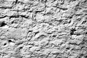 Texture of a concrete wall with cracks and scratches which can be used as a background