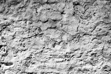 Texture of a concrete wall with cracks and scratches which can be used as a background