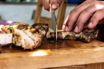 Cut the meat on the table barbeque